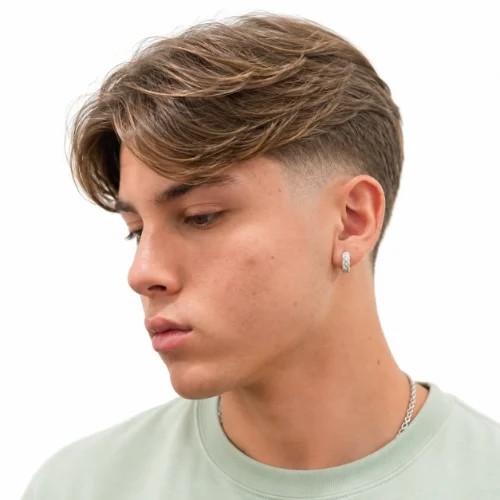 Low taper curtains hairstyle with middle part